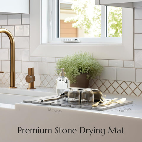 Stone dish mat slate gray Kitchen sink area with a stone drying mat, gold faucet, and decorative elements.