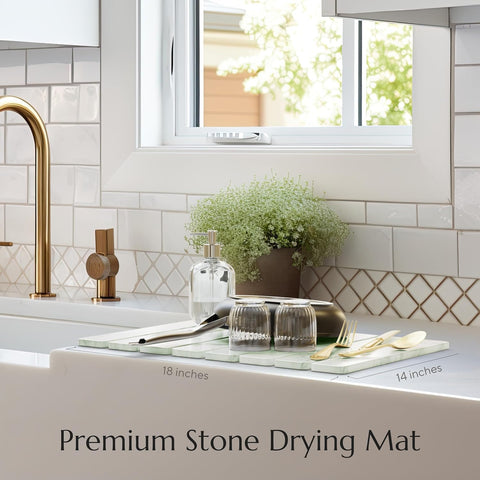 Stone dish mat sage green Kitchen sink area with a stone drying mat, faucet, and window.